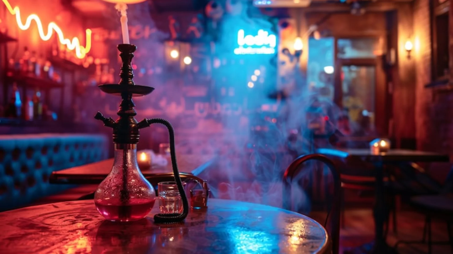 Premium hookah setup with colorful shisha flavors and smoke in warm amber lighting at Carnys hookah lounge in Encino